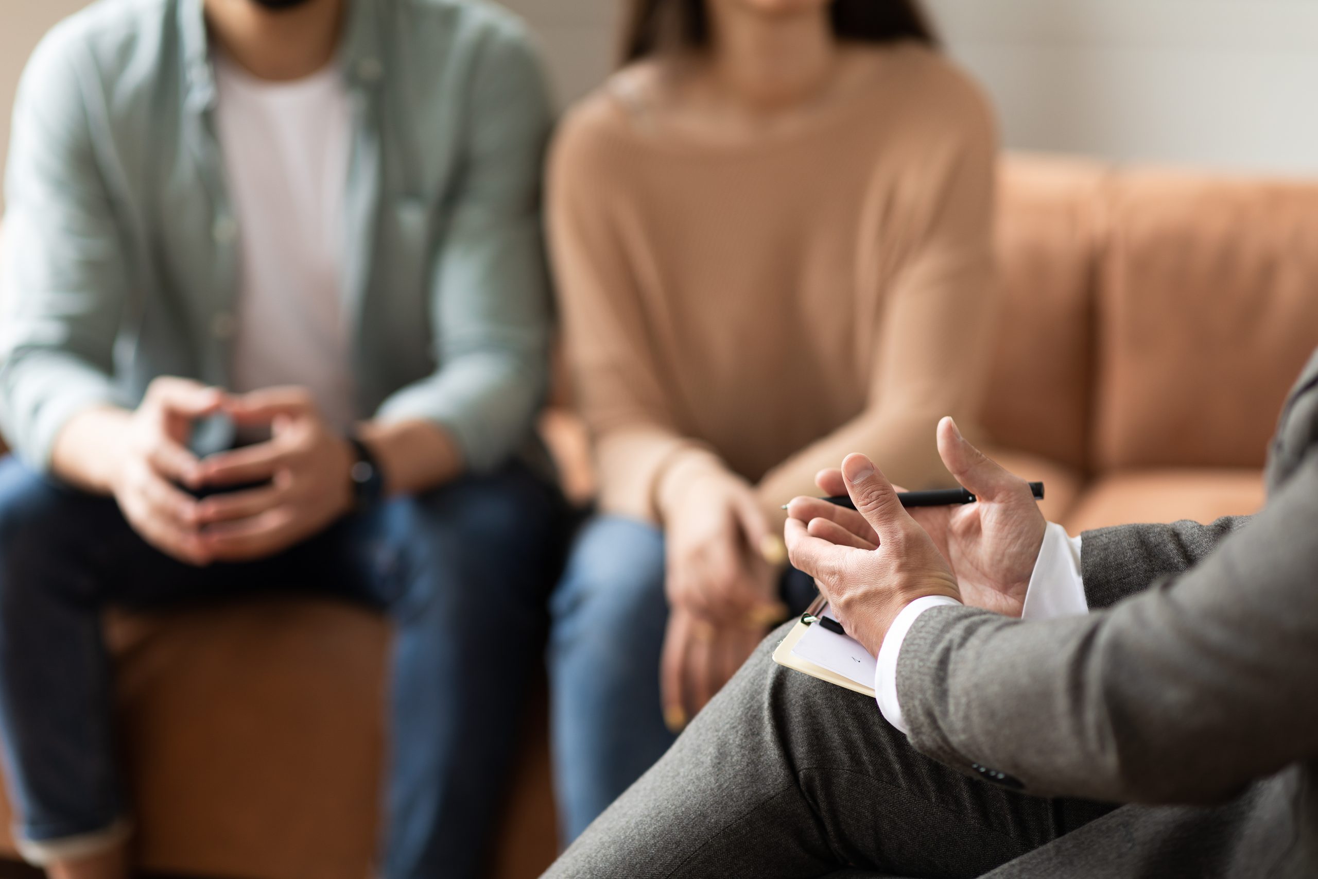 Couple talking to a lawyer.